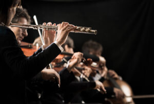 Classical music concert: flutist close up